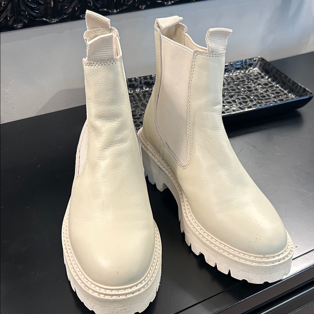 Elegant Cream Dolce Vita rain boots.